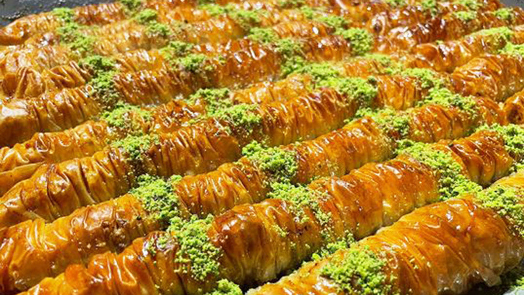 Maple Baklava in logs with pistachio crumbs.