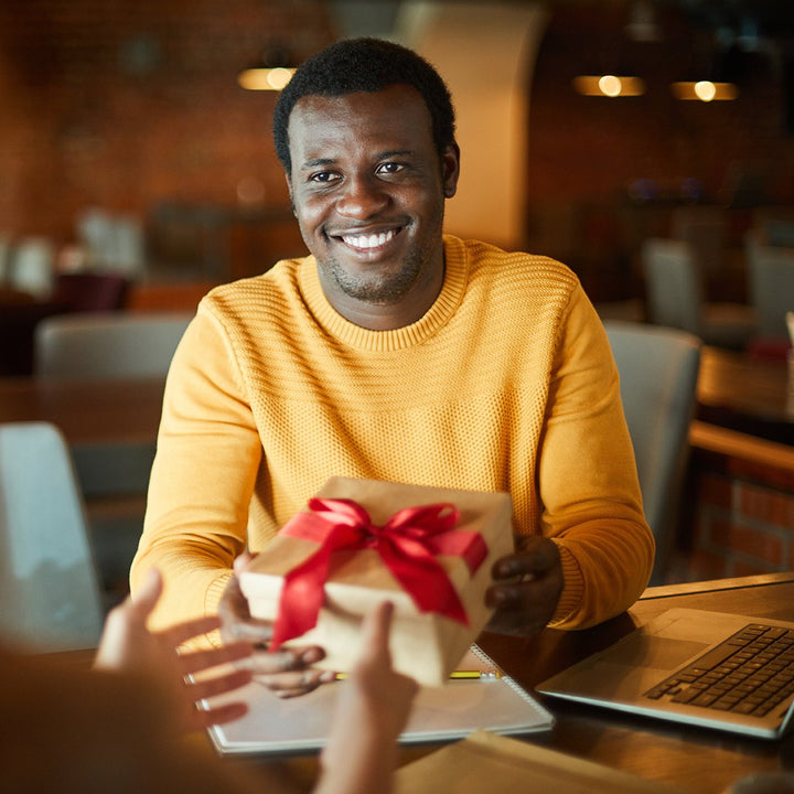 A gift being given to a corporate employee.