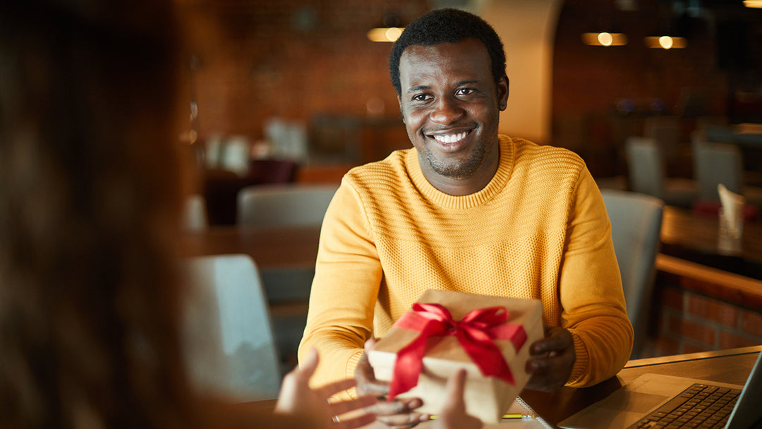 A gift being given to a corporate employee.