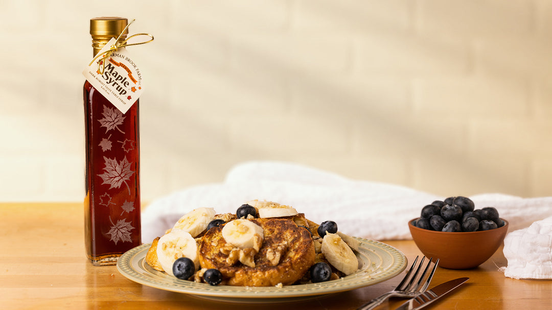 A healthy sugar alternative, maple syrup from Carman Brook Farm being poured over fruit and french toast.