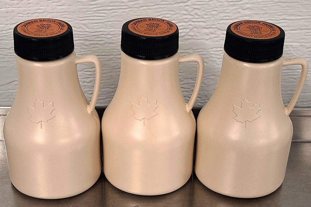 Party favor bottles filled with real maple syrup.